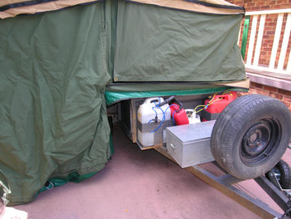 Fiona checks inside and I do outside of new camper trailer